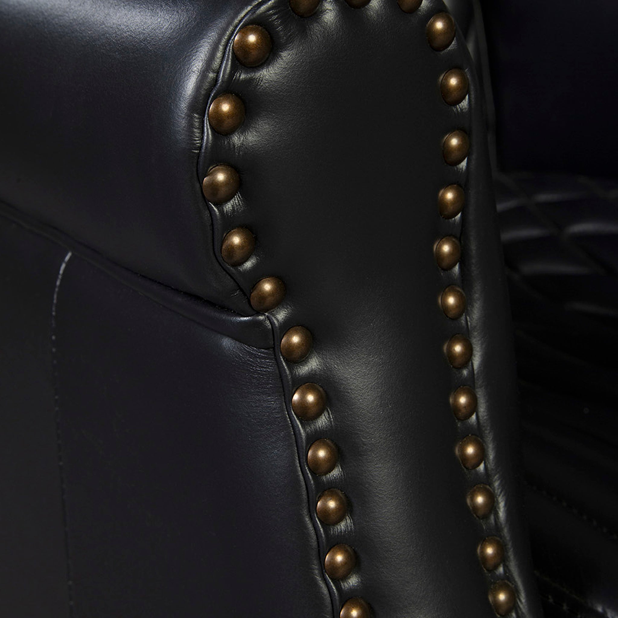 Black Les Puces Leather Club Chair: Brass nailhead trim close-up