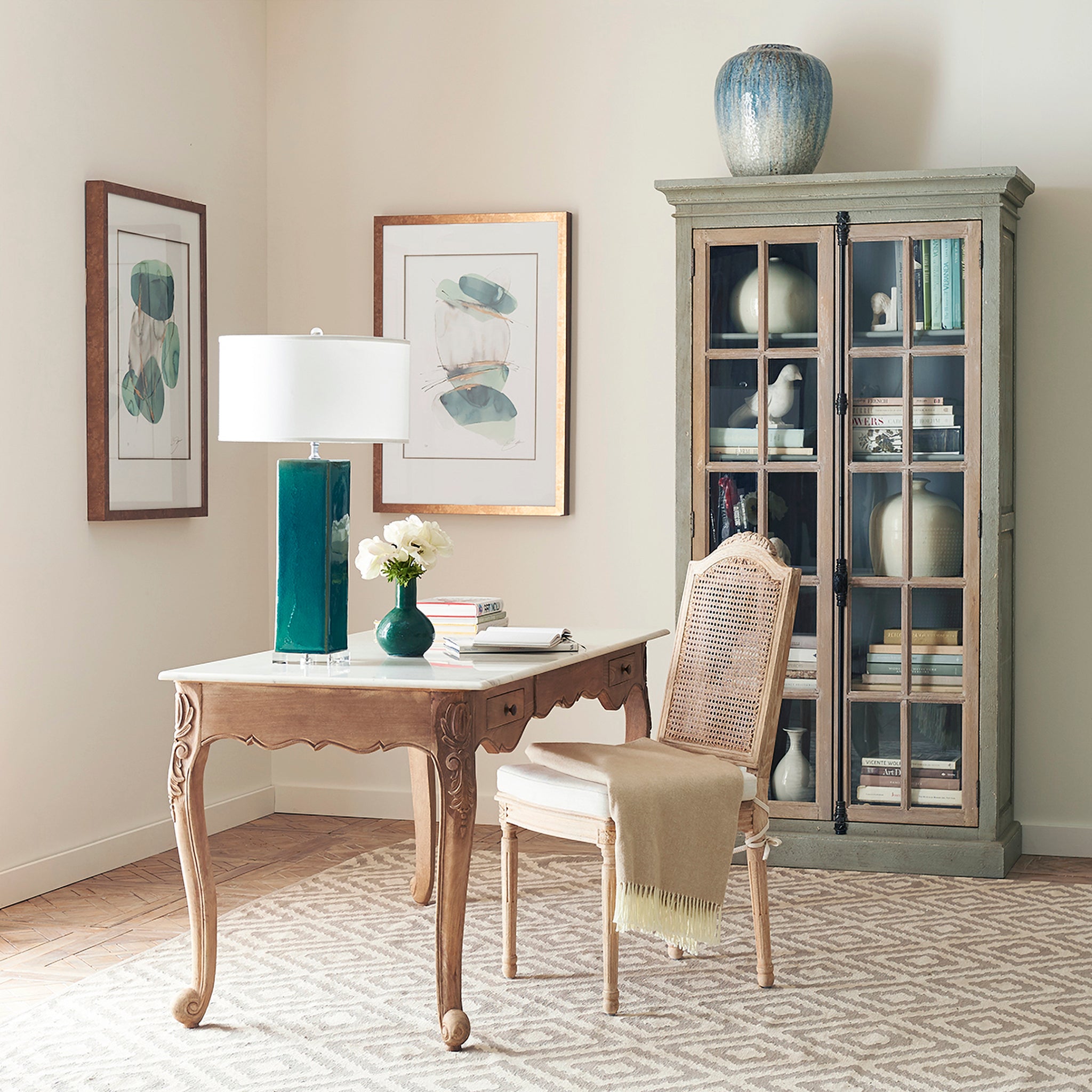 The Memsahib's Desk in a Living Room Setting by a Chair with a Lamp on Top