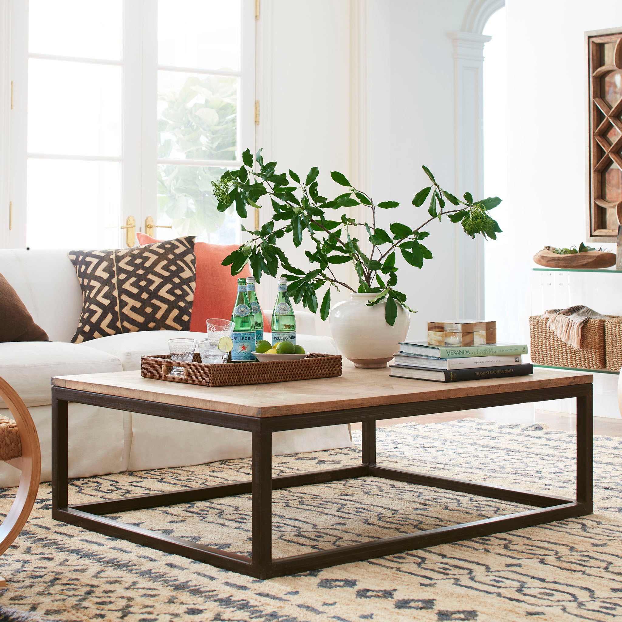Original Parquet Coffee Table in a Living Room Setting: Standing on a Beige Carpet with a White Couch in the Background