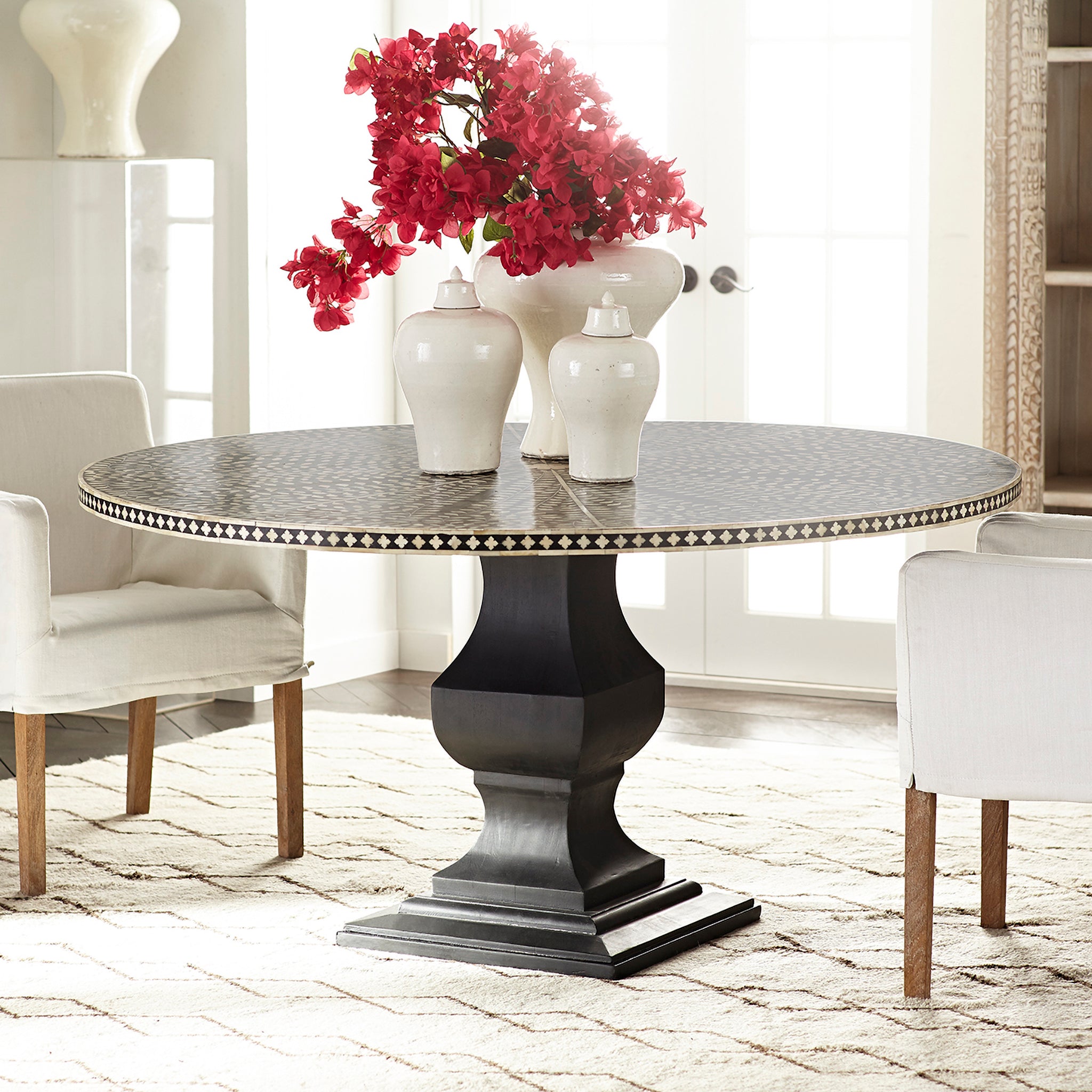 Moorish Dining Table in a Living Room Setting With Flower Vase and Two Other Vases on Top