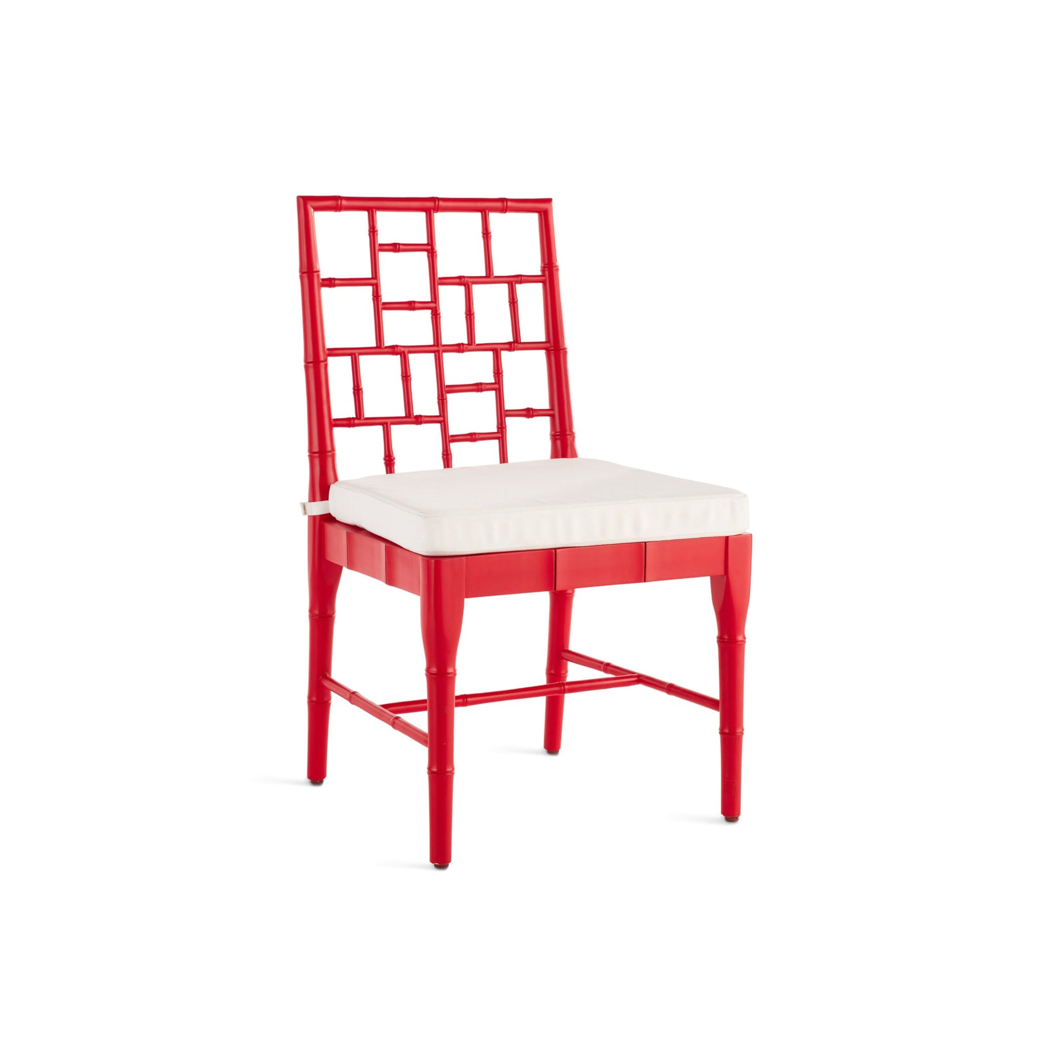 Red Chinese Chippendale dining chair with a white cushion on the cane seat, featuring a lattice back design.