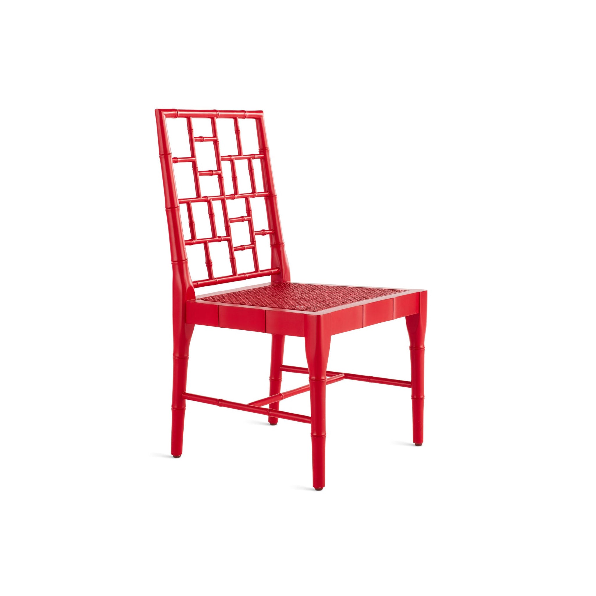 Red Chinese Chippendale dining chair with a lattice-style back and cane seat, viewed at an angle.