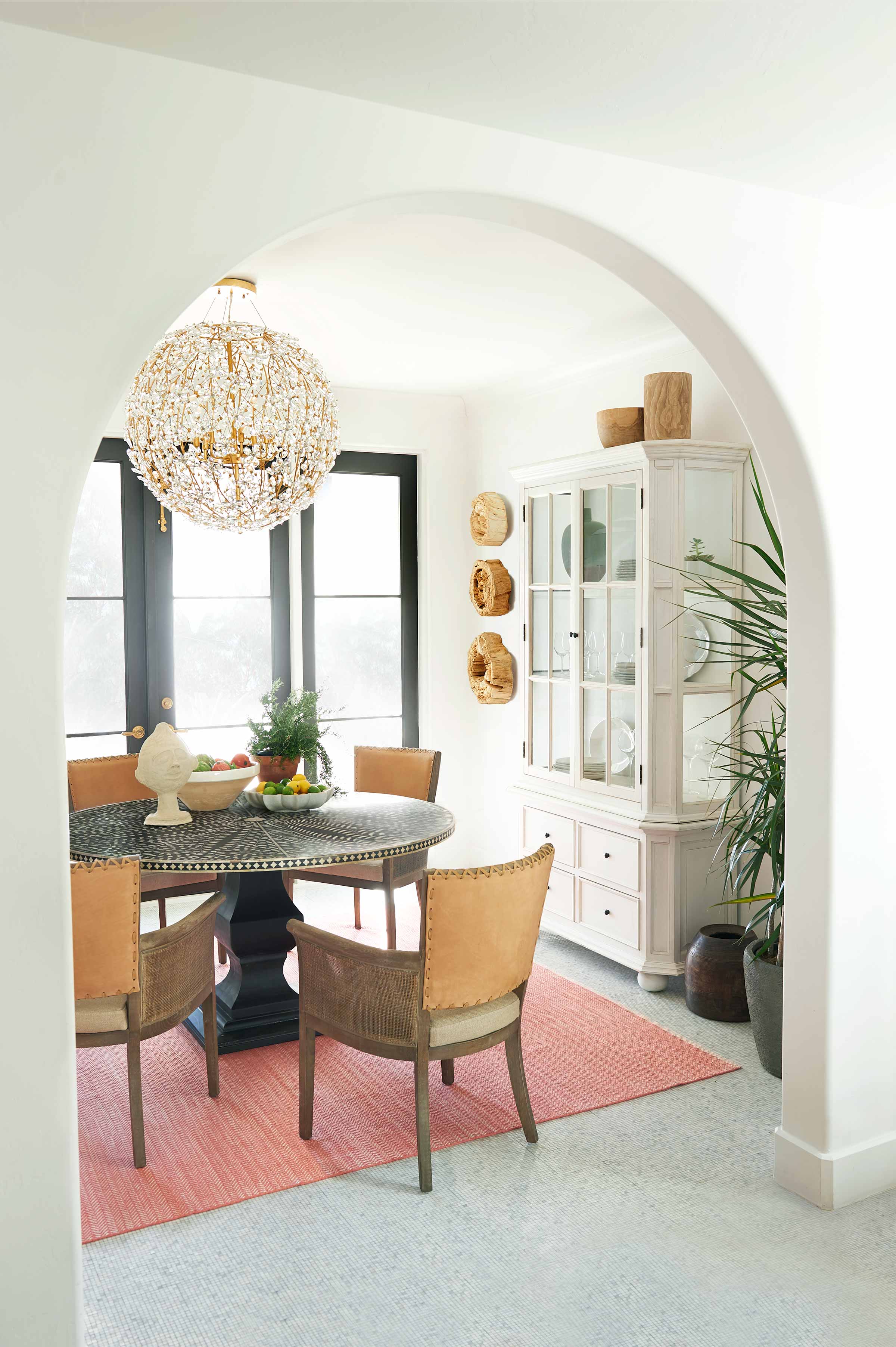 Moorish Dining Table in a Dining Room Setting With Bowls of Fruits, Bust, and a Flower Pot on Top