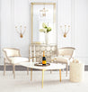 Mid-Century Modern Egg Coffee Table – Elegant setup, gold accents, white decor, champagne glasses.