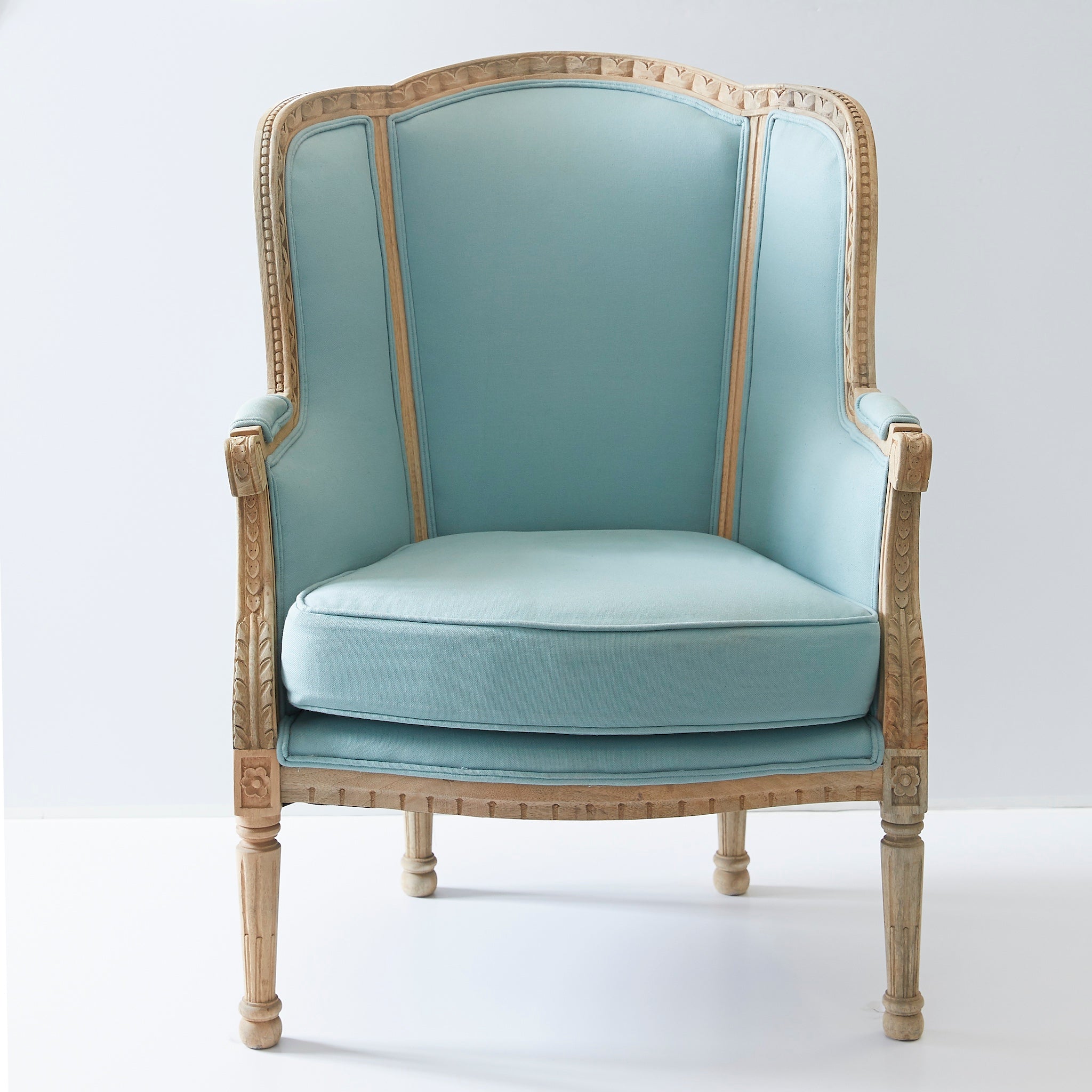 Louis XV Wing Chair with blue upholstery and a wooden frame
