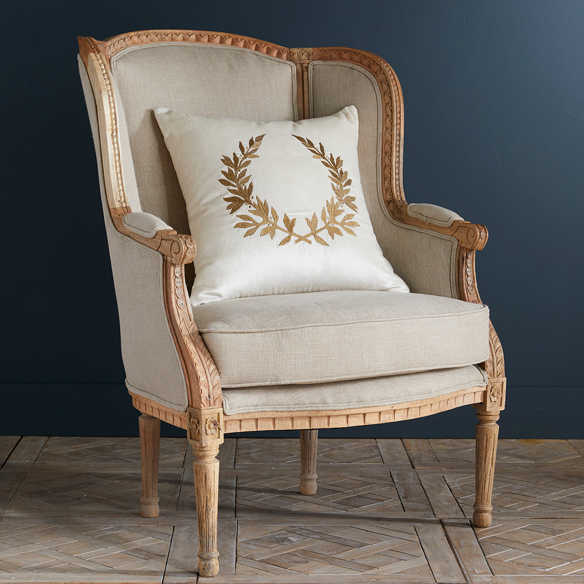 Natural linen Louis XV Wing Chair with a pillow on top