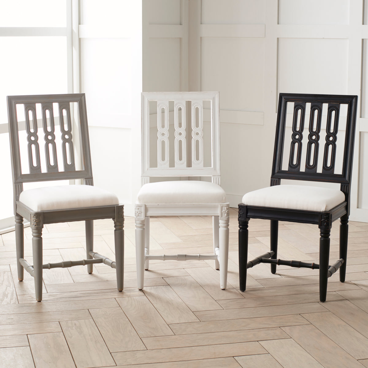 Gustavian Dining Chairs all Colors in a Line in a Room Setting