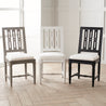 Gustavian Dining Chairs all Colors in a Line in a Room Setting