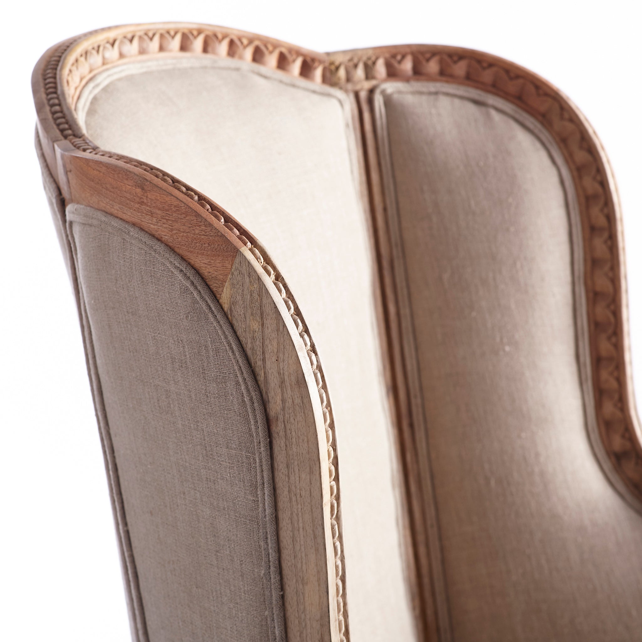 Side close-up view of a natural linen Louis XV Wing Chair