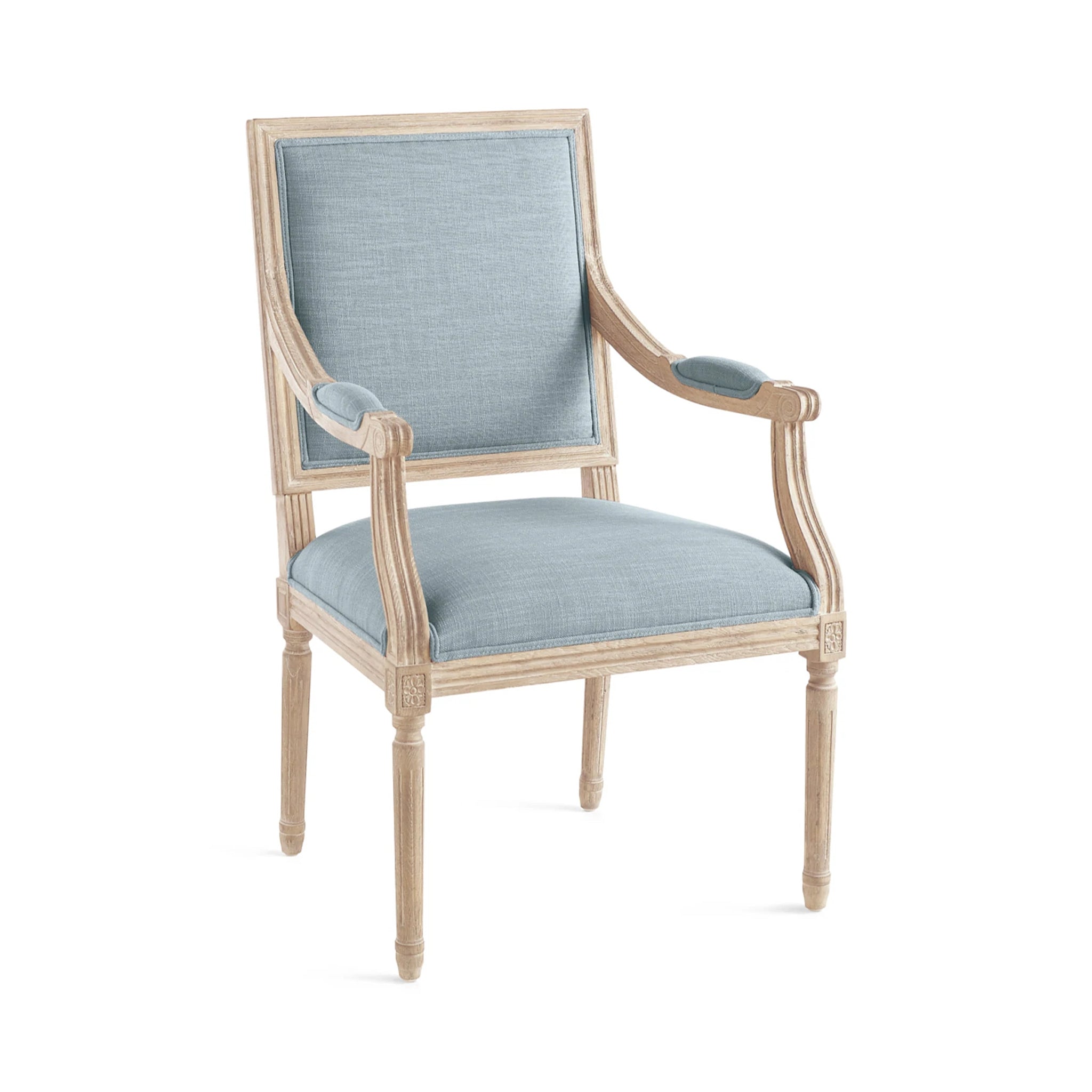 Chateau Chair With Arm – angled view, French blue linen, bleached wood, white background.