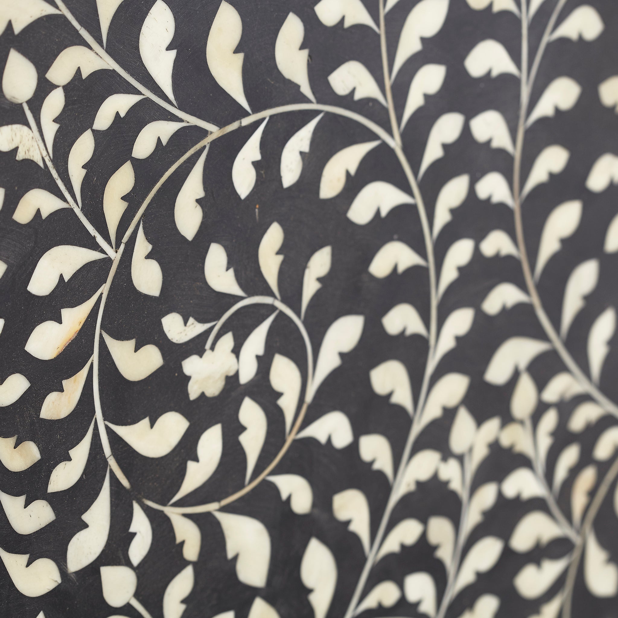 Maharaja Headboard (Mother of Pearl, Bone Inlay) - Detailed view of curved vine pattern inlay.