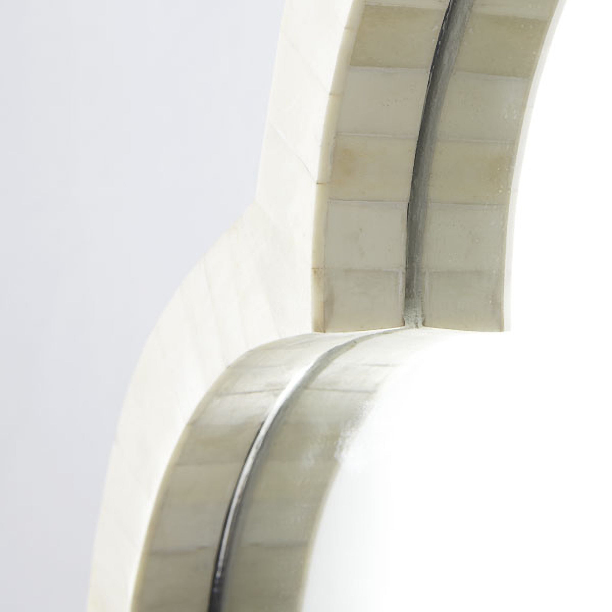 Clover Bone Mirror – close-up of edge detail, showing textured bone inlay and curved frame.