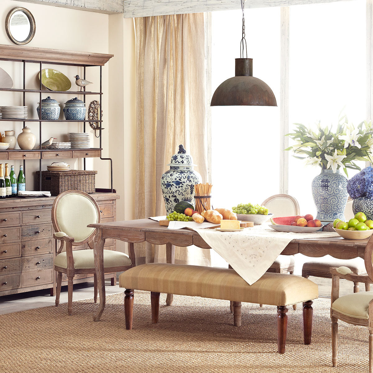 French Country Dining Table - Weathered in a Dining Room Setting: Standing on a Beige Carpet