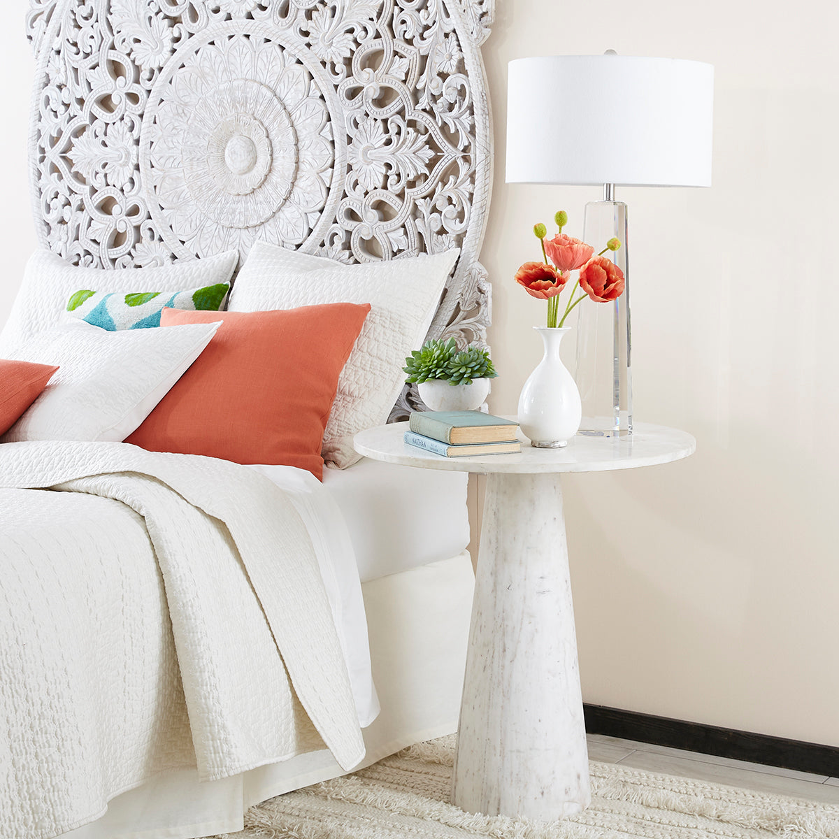 Banswara Marble Side Table – Styled as a bedside table, with lamp, flowers, books.