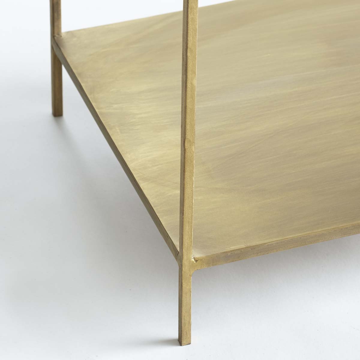 Close-up view of the bottom shelf and legs of the Tower Bookshelf