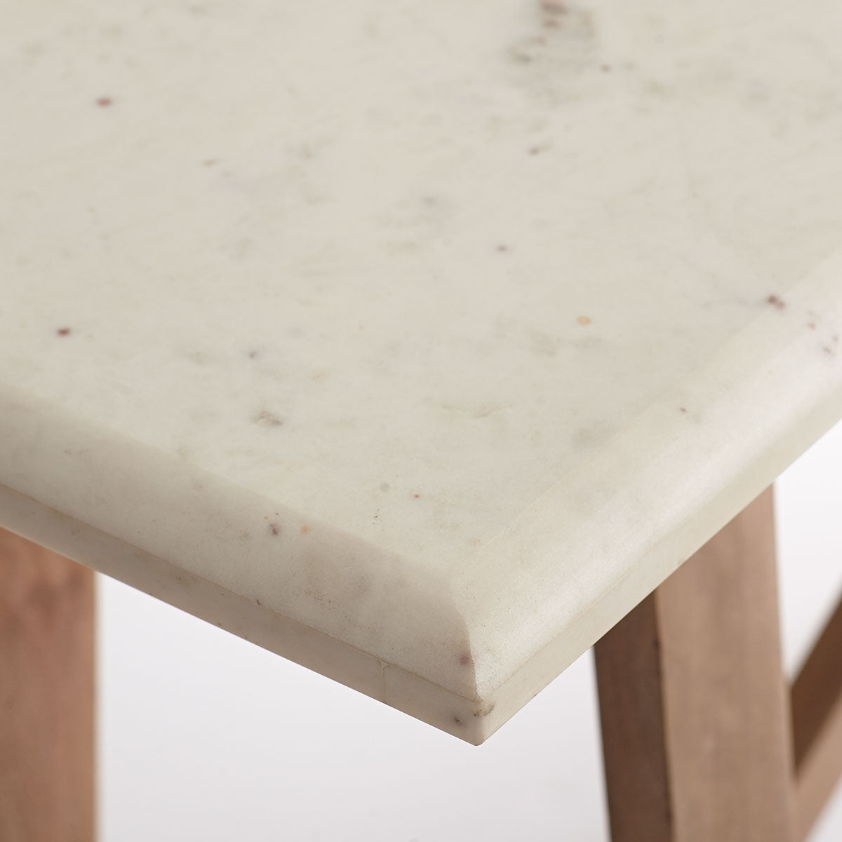 Marble Top Console Table – Close-up of white marble surface, subtle veining, beveled edge.