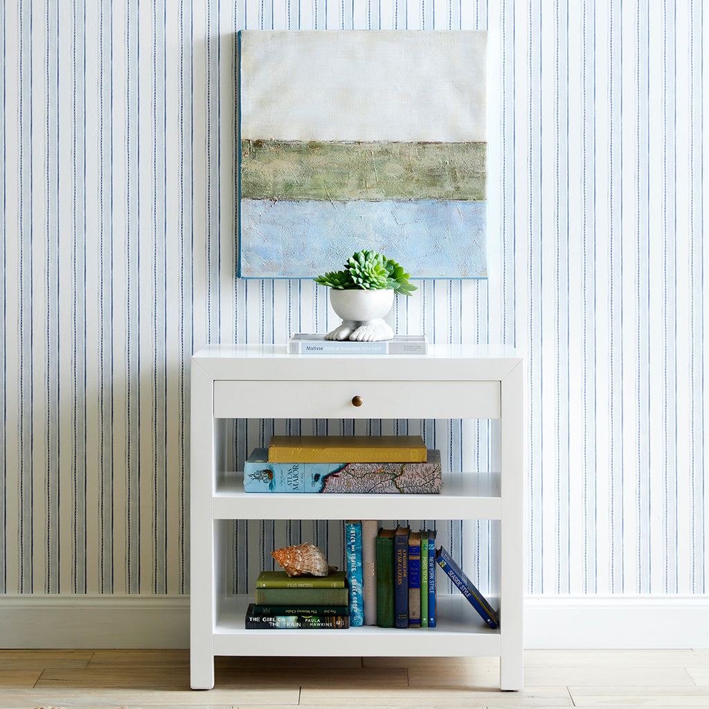 Sleek Side Table In Room With Items Placed On It
